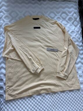 Fear of God Essentials Long Sleeve Crewneck in Pale Yellow